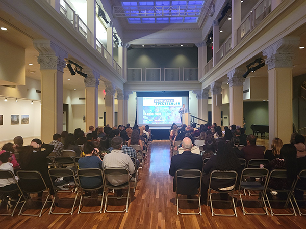 View of stage from behind audience in historic venue