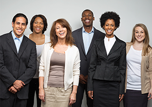 Group of young professionals posing happily