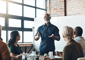 man leading a small group of professional in training session