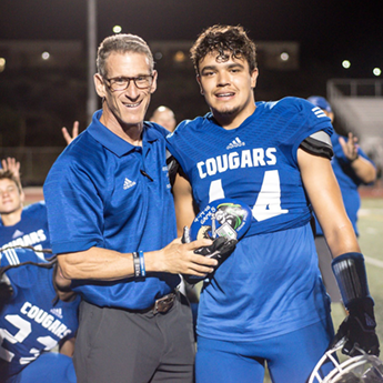 Sean Cannady and football coach after game