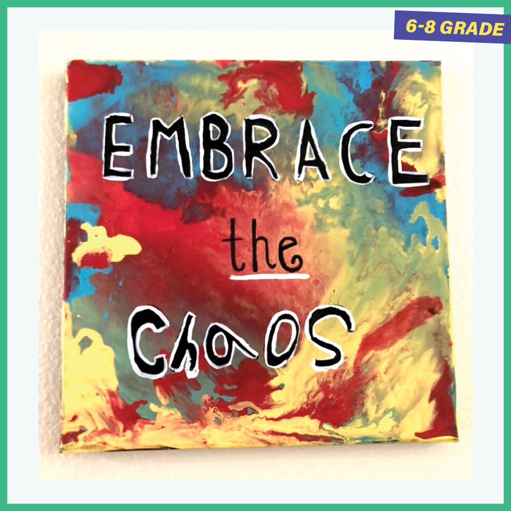 Multicolored painting with the words EMBRACE THE CHAOS