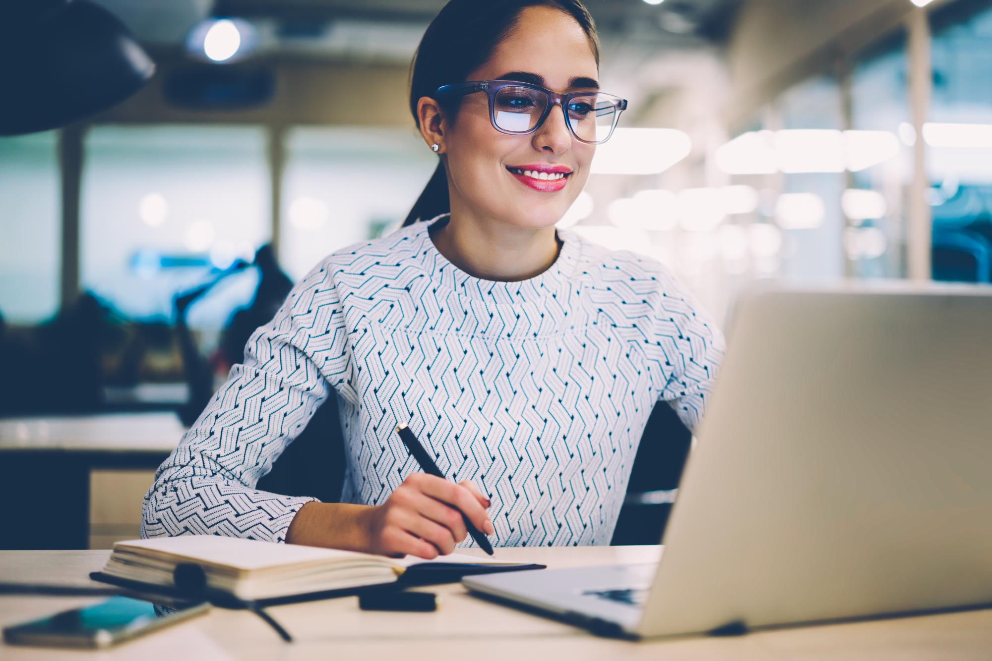 Woman at computer watching screen