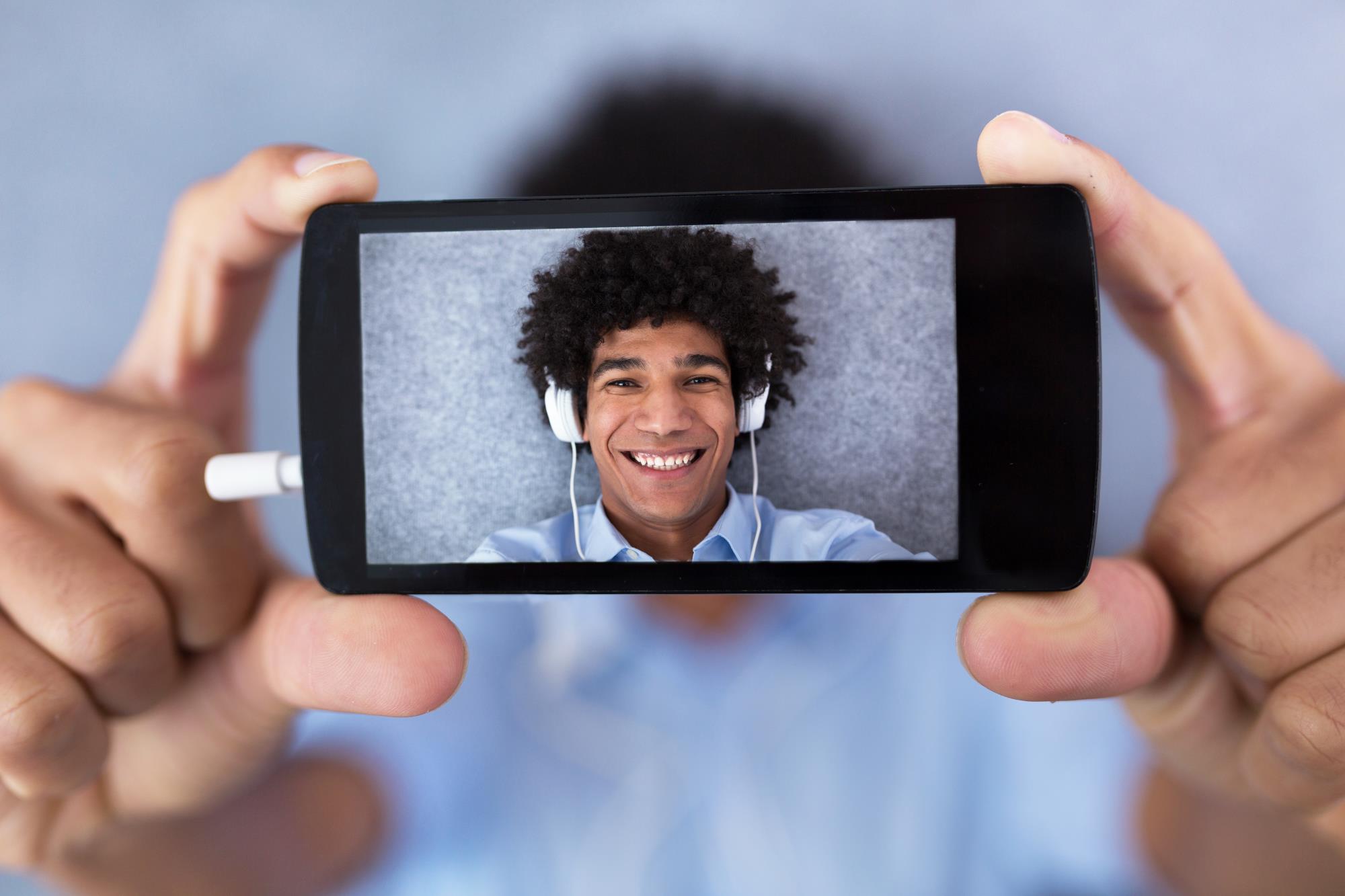 Young man taking a selfie