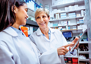 CTE teacher with student in pharmacy