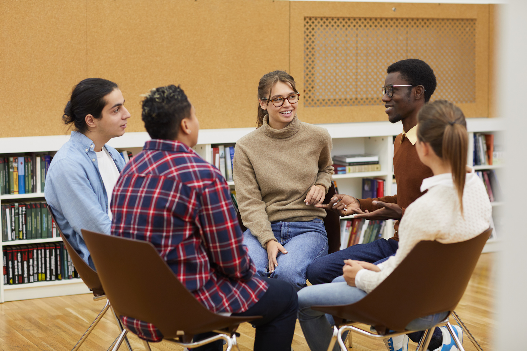 a group of teenagers engaged in conversation