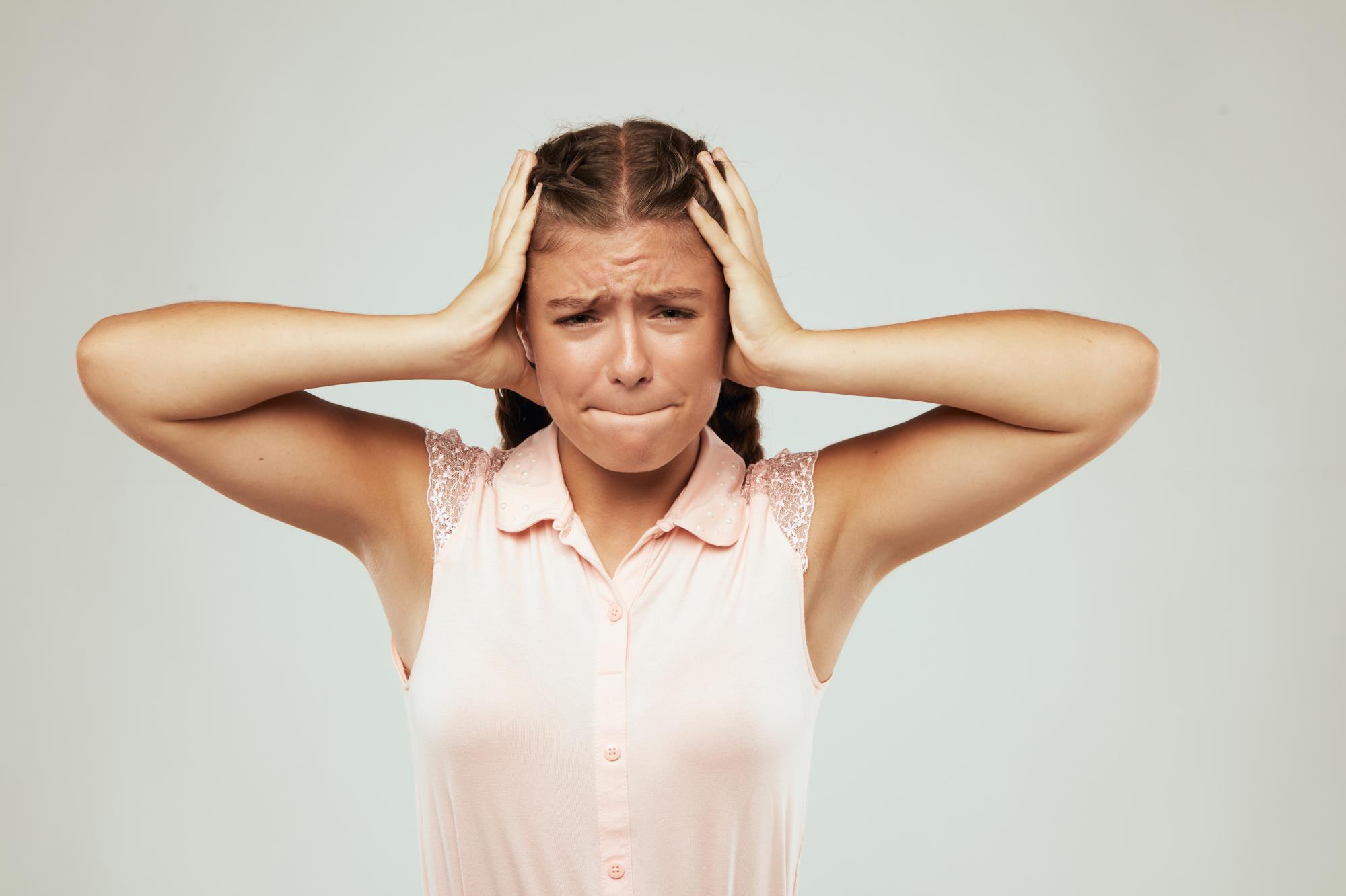 a young girl looks stressed