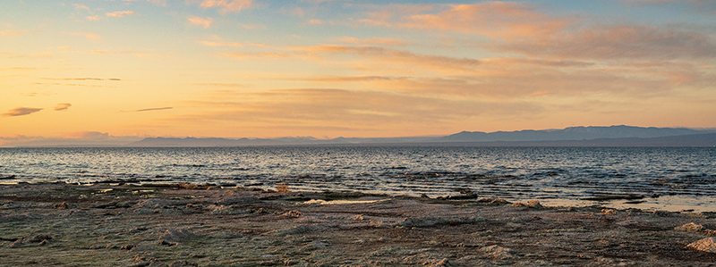 Salton Sea with desert in the foreground and mountains in the background