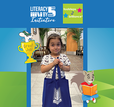 Young girl clutching bag holding holding her prize